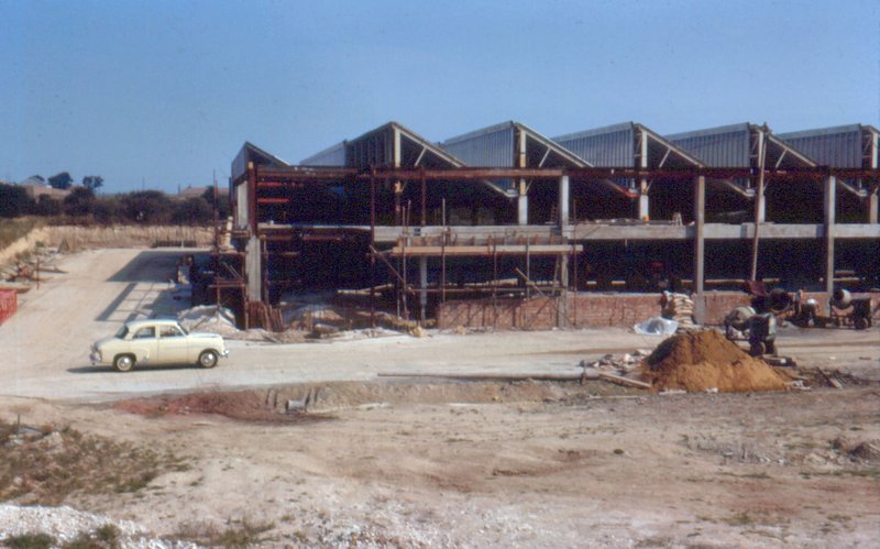 Early construction of the factory showing steel framework being erected, circa 1962